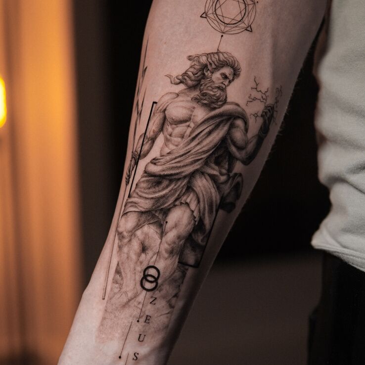 Tattoo Zeus from Greek Mythology in characters motif and realistic style On the arm