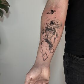 Tattoo Astronaut with Planets – Linework and Geometric Accents on the forearm motif: cosmos style: geometric