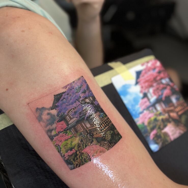 Tattoo Colorful Japanese Landscape - Sakura Temple in nature motif and realistic style On the arm