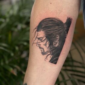 Tattoo Portrait of Musashi Miyamoto (Vagabond) on the forearm motif: faces style: graphic / illustrative