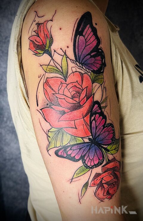 Tattoo Red roses with butterflies in colorful motif and graphic / illustrative style on the upper arm
