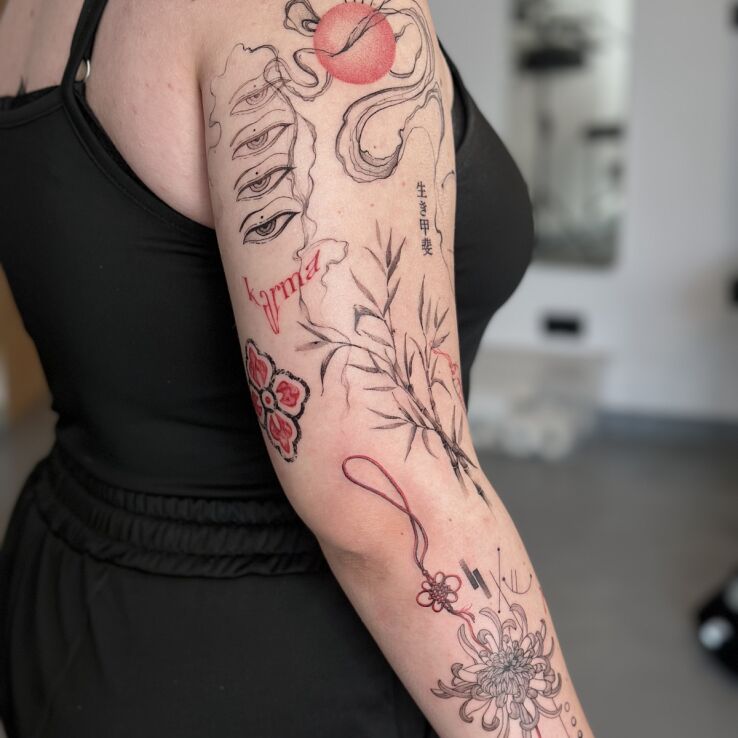 Tattoo Sleeve focusing on Eastern motifs in black-red color scheme in sleeves motif and graphic / illustrative style On the arm