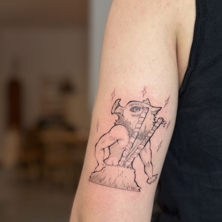 Tattoo Inosuke (Demon Slayer / Kimetsu no Yaiba) in graphic / illustrative style on the upper arm