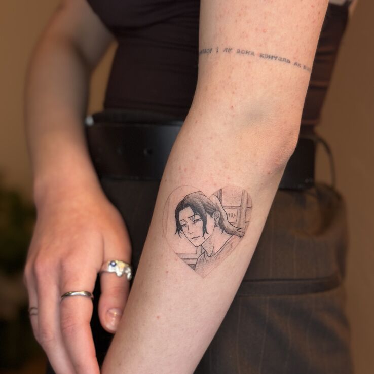 Tattoo Howl (Howl's Moving Castle) in a Heart in characters motif and graphic / illustrative style on the forearm