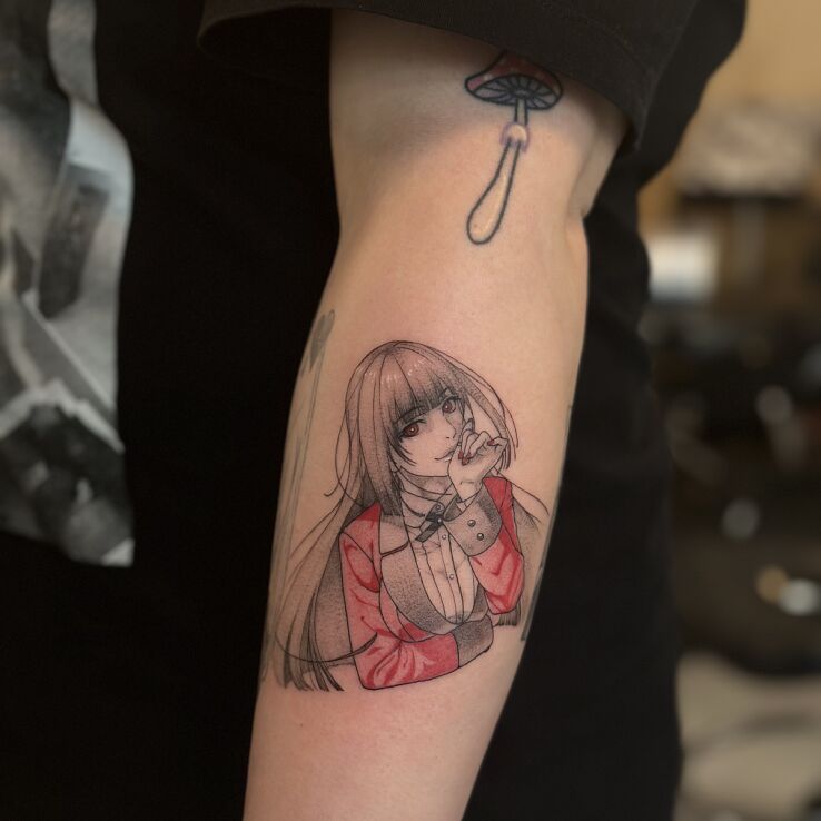 Tattoo Yumeko Jabami (Kakegurui) with red accent in black and gray motif and graphic / illustrative style on the forearm