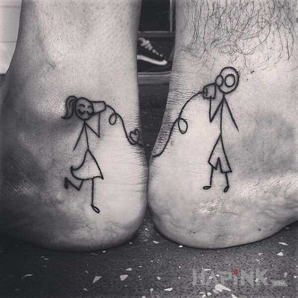 Tattoo Stick man in characters motif on the foot
