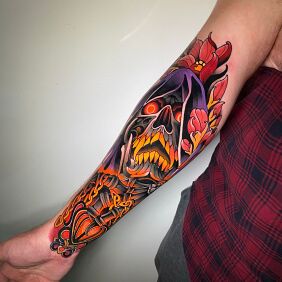 Tattoo Burning Skull and Purple On the arm motif: fantasy style: neo-traditional