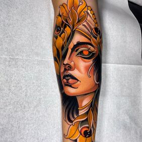 Tattoo Female Portrait in Fiery Colors On the arm motif: colorful style: neo-traditional