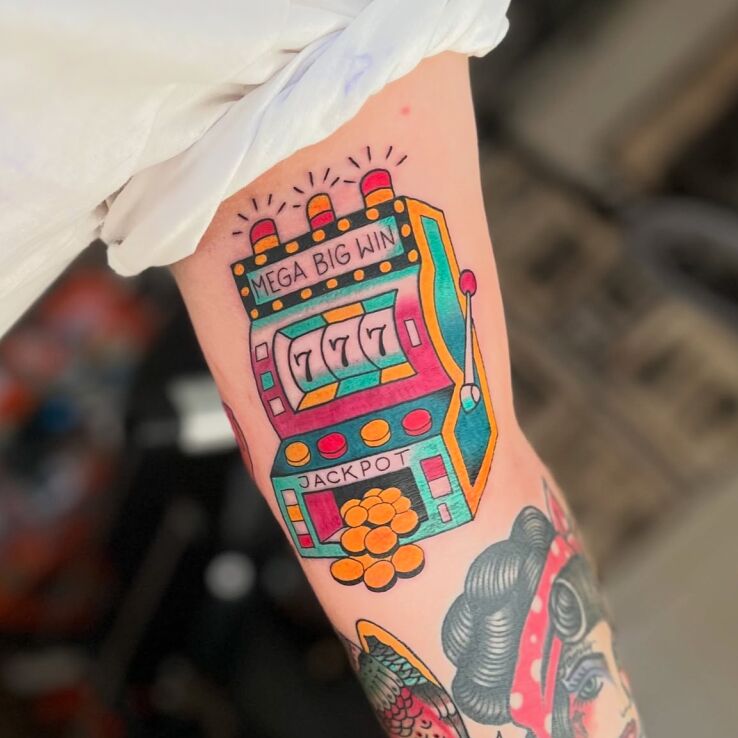 Tattoo Jackpot in casino motif and oldschool style On the arm