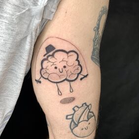 Tattoo Brain in cartoon form On the arm motif: funny style: dotwork