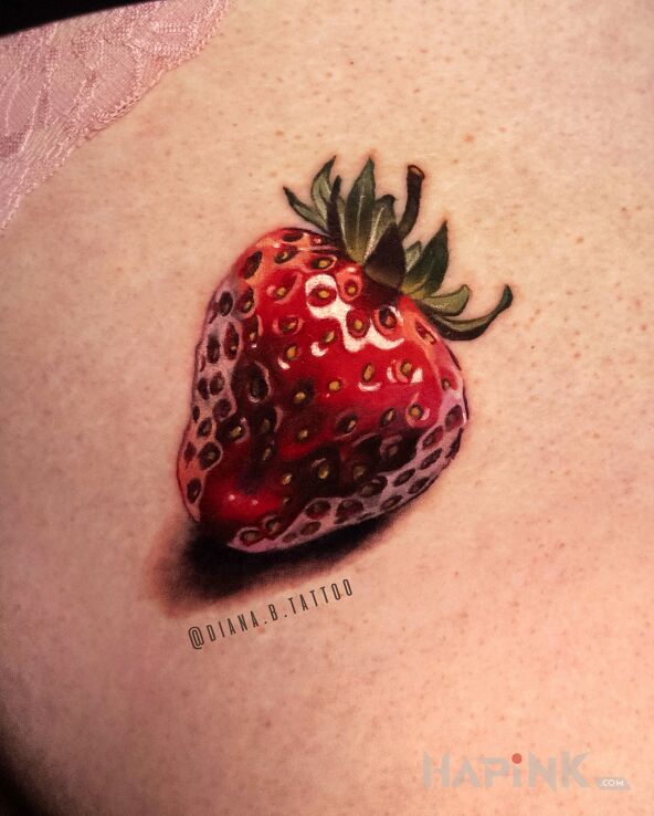 Tattoo Microrealistic Strawberry in colorful motif and realistic style on the buttocks