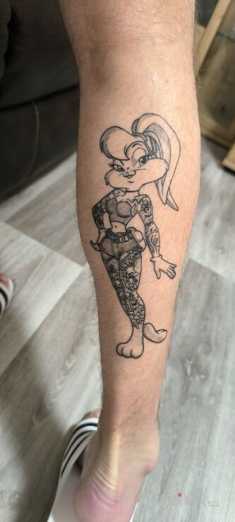 Tattoo Childhood in black and gray motif and graphic / illustrative style on the leg
