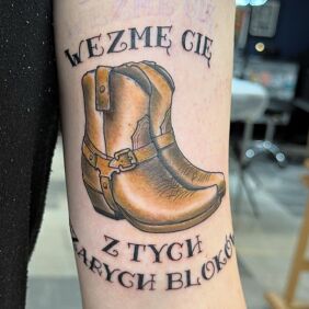 Tattoo Country vs. Concrete — A Tattoo with a Story On the arm motif: colorful style: calligraphy