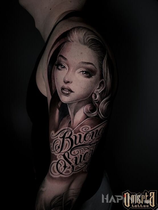 Tattoo Dark Beauty in black and gray motif and calligraphy style on the upper arm