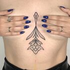 Sternum tattoo with floral linework