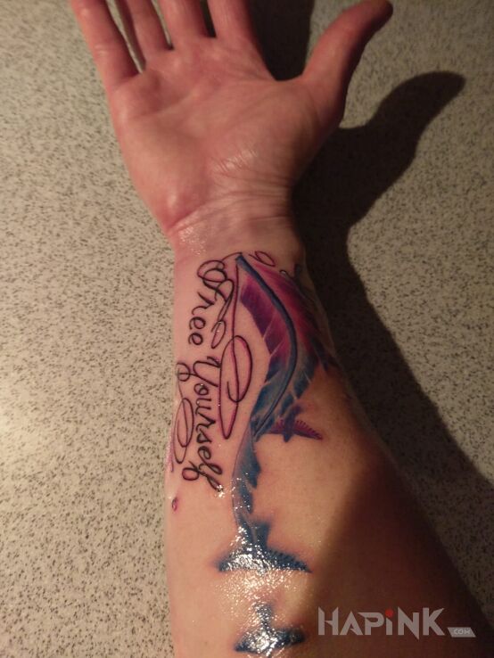 Tattoo Free Yourself in lettering motif on the forearm