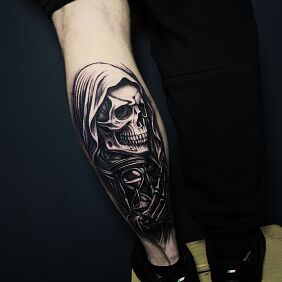Tattoo Skeleton in a hood with an hourglass on the calf motif: faces style: graphic / illustrative
