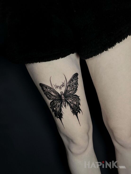 Tattoo Dark Butterfly in dark motif and graphic / illustrative style on the leg