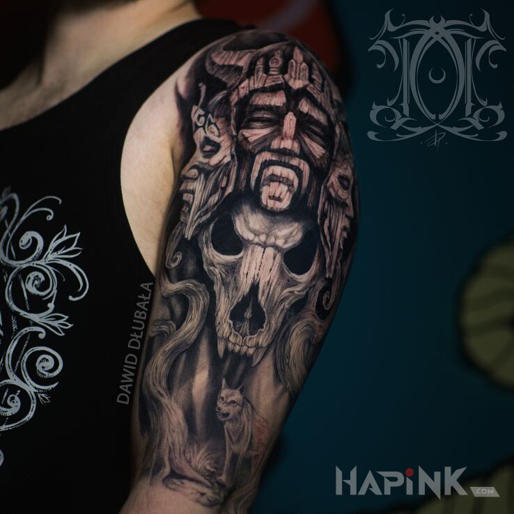 Tattoo Three-Headed in black and gray motif and realistic style on the upper arm