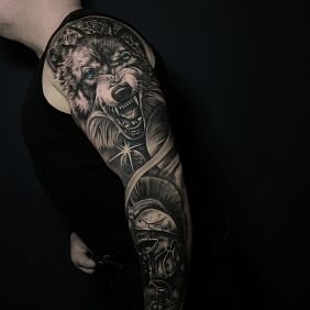 Tattoo Wolfhound and legionnaire on one arm On the arm motif: objects style: realistic