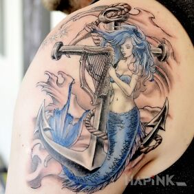 Tattoo Siren on the shoulder blades motif: characters