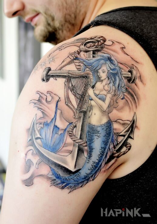 Tattoo Syrena in characters motif on the shoulder blades