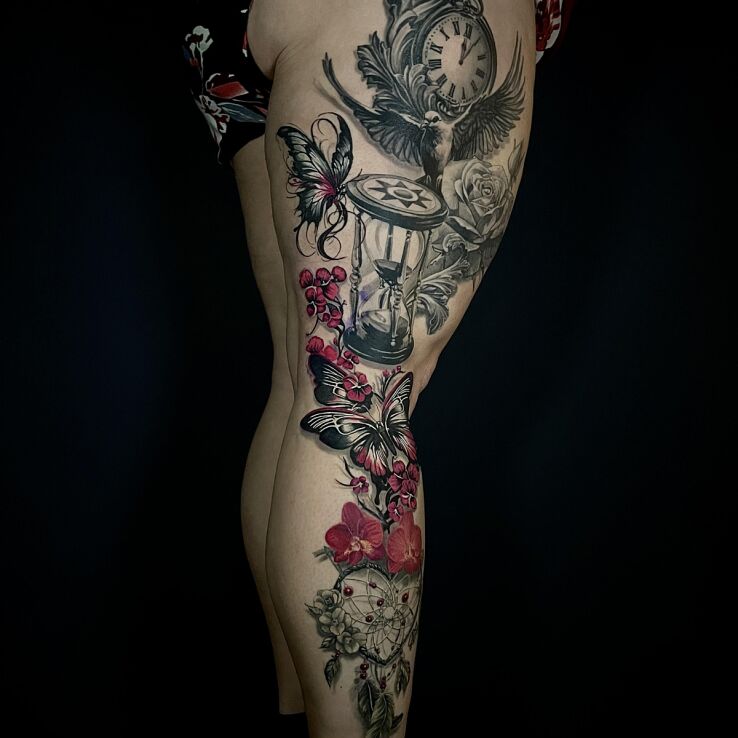 Tattoo Mishmash of motifs on the entire leg in butterflies motif and realistic style on the thigh