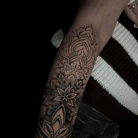 Tattoo Mandala combined with geometry on the forearm motif: mandalas style: graphic / illustrative
