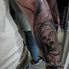 Tattoo Haunted Nun on the forearm motif: characters style: realistic