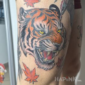 Tattoo Colorful Tiger on the thigh motif: animals style: japanese / irezumi