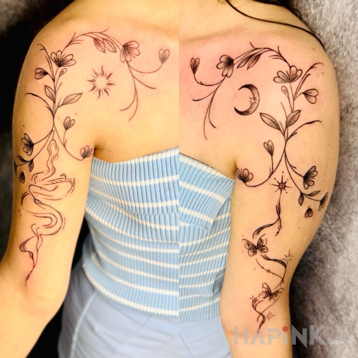 Tattoo Delicate flowers with butterflies and a snake in floral motif and graphic / illustrative style On the arm