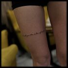 Small inscription on the thigh