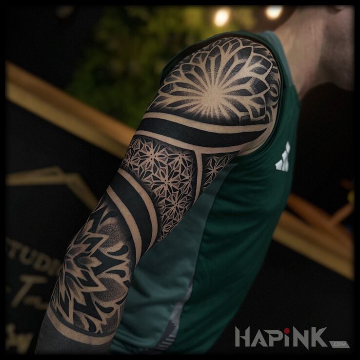 Tattoo Geometric Sleeve in ornaments motif and geometric style On the arm