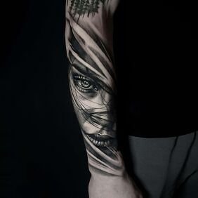 Tattoo Realistic female face with transitions On the arm motif: faces style: realistic