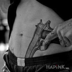 Tattoo Gun on the stomach motif: sexy style: realistic