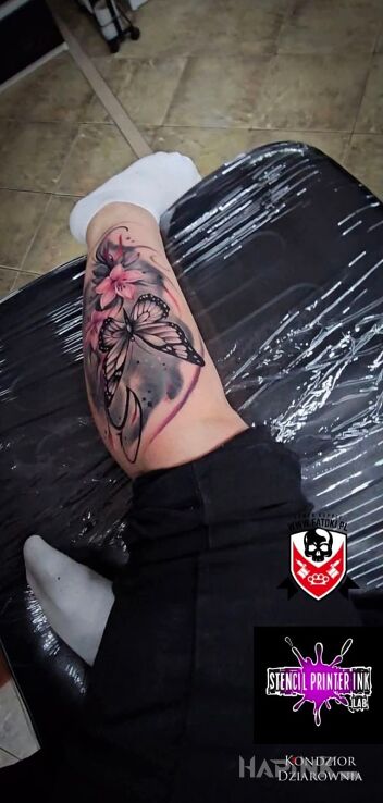 Tattoo Butterfly cover-up in butterflies motif and realistic style on the calf