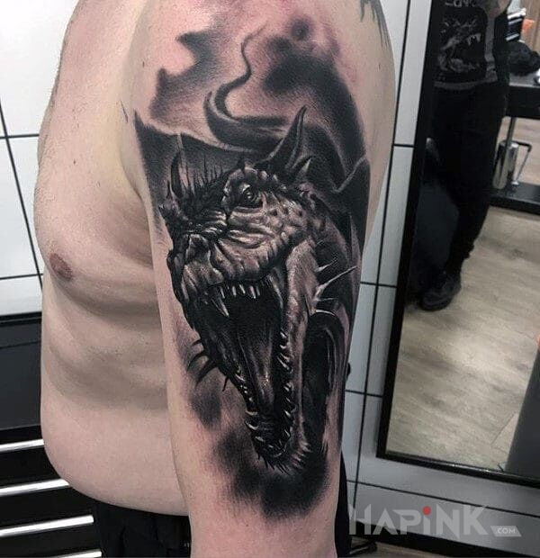 Tattoo Paszcza smoka in dragons motif on the upper arm