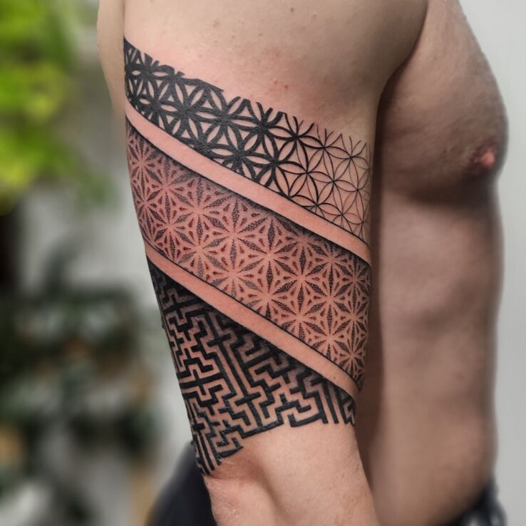 Tattoo Geometric Tattoo in ornaments motif and geometric style on the upper arm