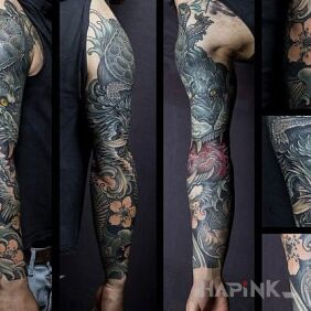Tattoo Dragon in flowers on the forearm motif: flowers style: japanese / irezumi