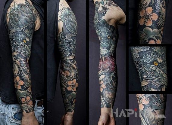 Tattoo Smok w kwiatach in flowers motif and japanese / irezumi style on the upper arm