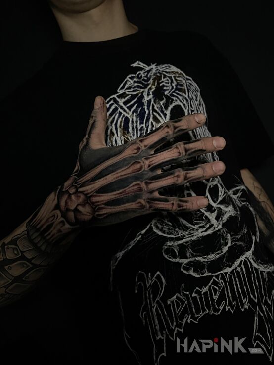 Tattoo Skeleton Hand in anatomical motif and realistic style on the fingers
