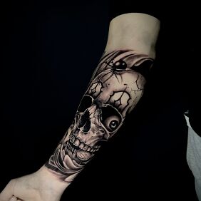 Tattoo Skull with spider eye On the arm motif: dark style: realistic