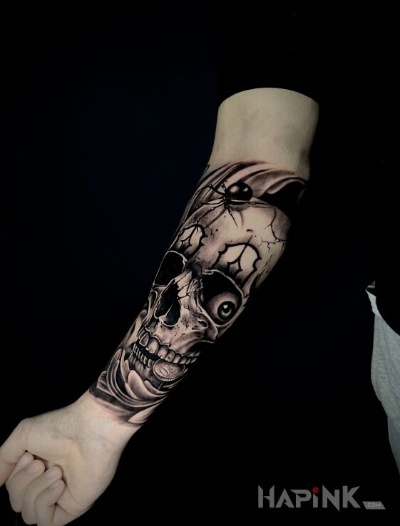 Tattoo Skull with spider eye in black and gray motif and realistic style On the arm