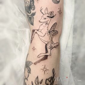 Tattoo Magical Deer on the forearm motif: flowers style: contour / linework