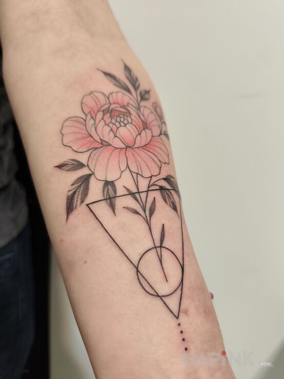 Tattoo Pink Peony in floral motif and contour / linework style on the forearm