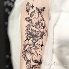 Tattoo Butterfly in Flowers On the arm motif: floral style: graphic / illustrative