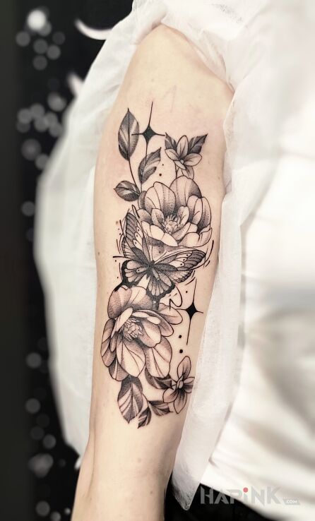Tattoo Butterfly in Flowers in butterflies motif and graphic / illustrative style On the arm