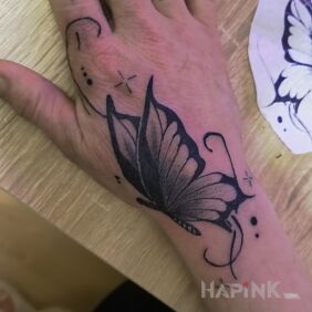 Tattoo Butterfly on the hand On the arm motif: butterflies style: graphic / illustrative