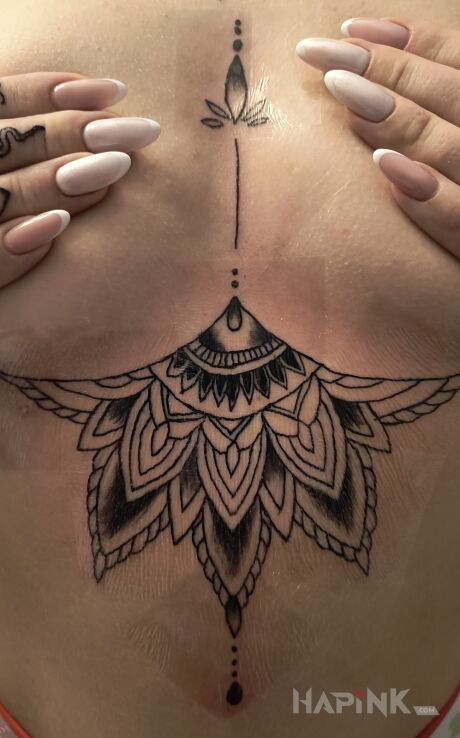 Tattoo Mandala in black and gray motif and graphic / illustrative style underboob