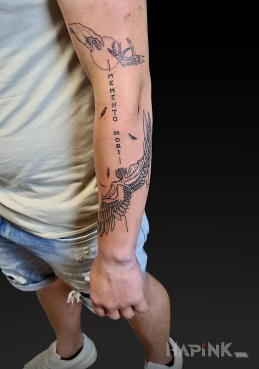 Tattoo Memento mori in black and gray motif and graphic / illustrative style on the forearm